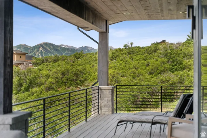 Wooden terrace featuring a mountain view