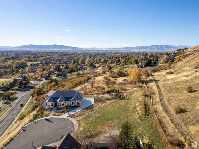 View of subject property featuring a mountainous background