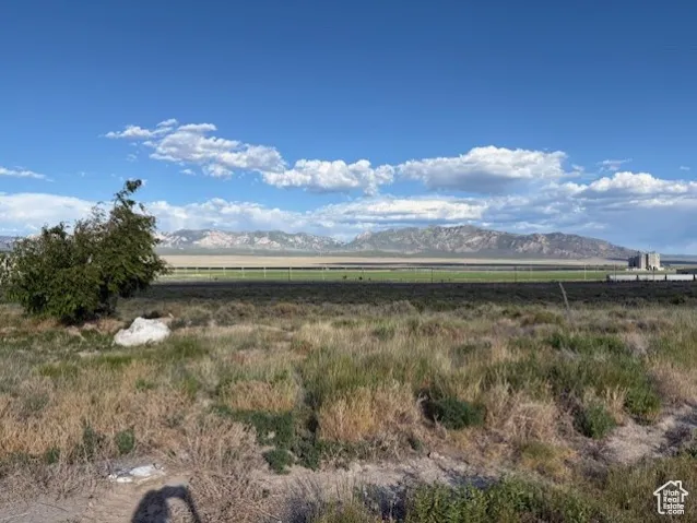 View of mountain background featuring rural landscape