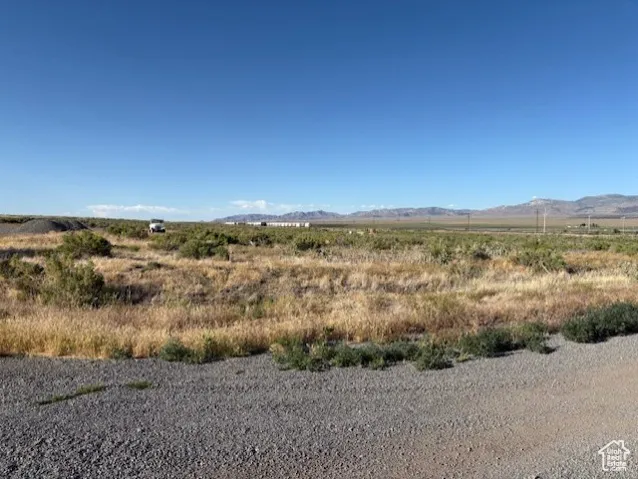 View of mountain backdrop with rural landscape