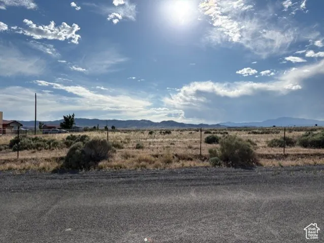 View of mountain backdrop featuring rural landscape