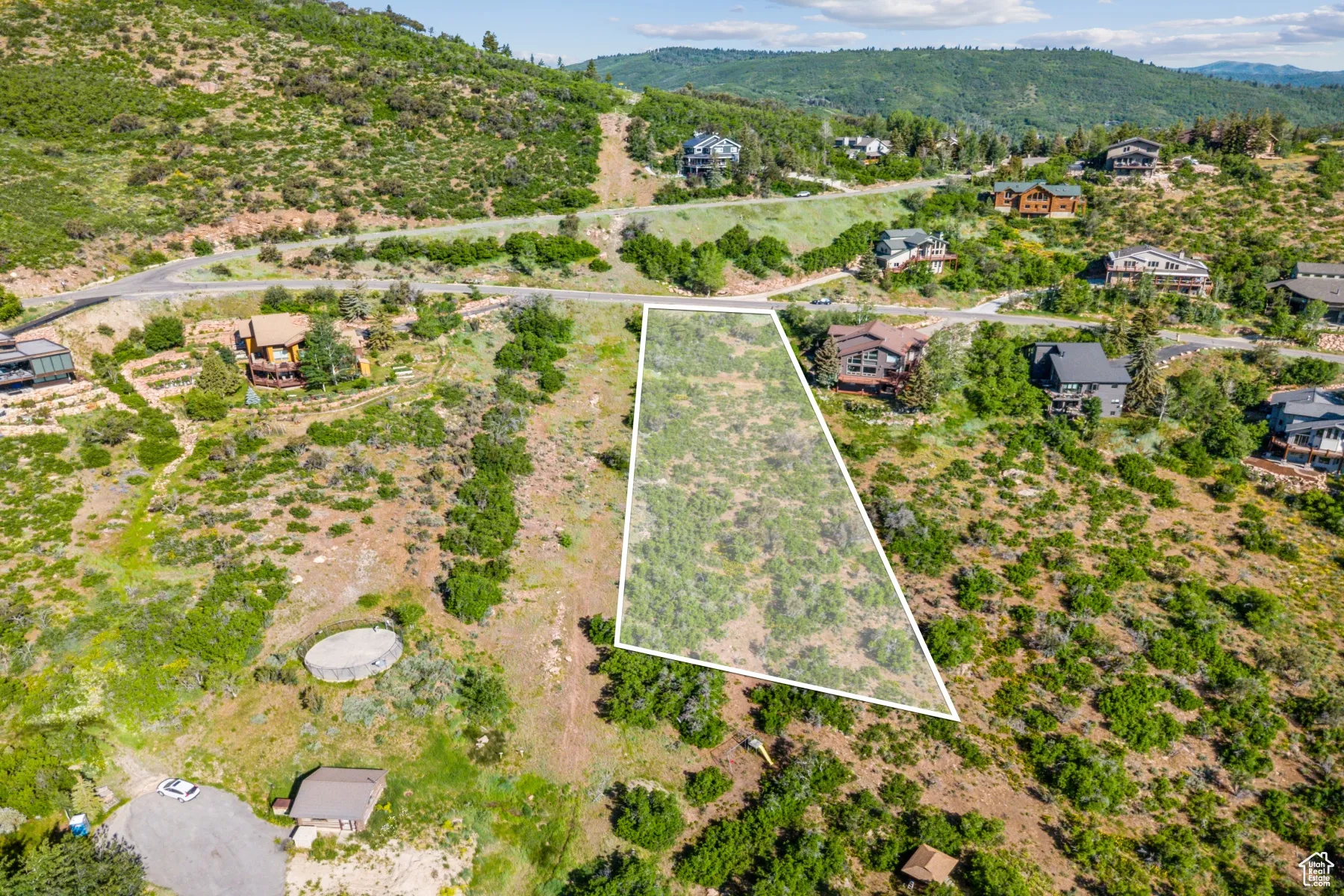 View of property location with a mountain backdrop and property parcel outlined
