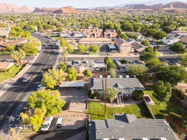 Aerial perspective of suburban area with a mountainous background