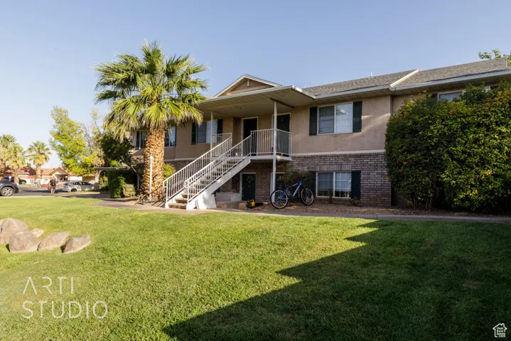 View of property with stairway