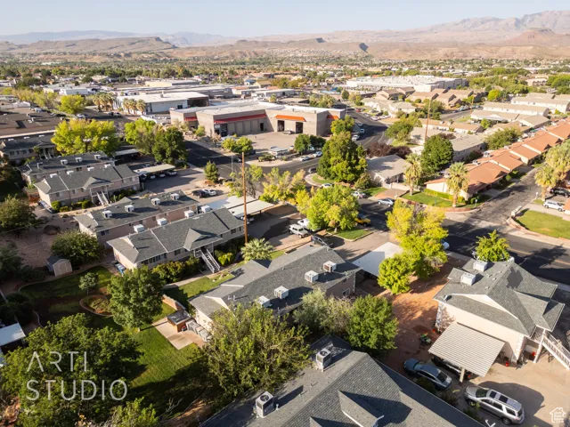 Aerial view of residential area featuring a mountainous background