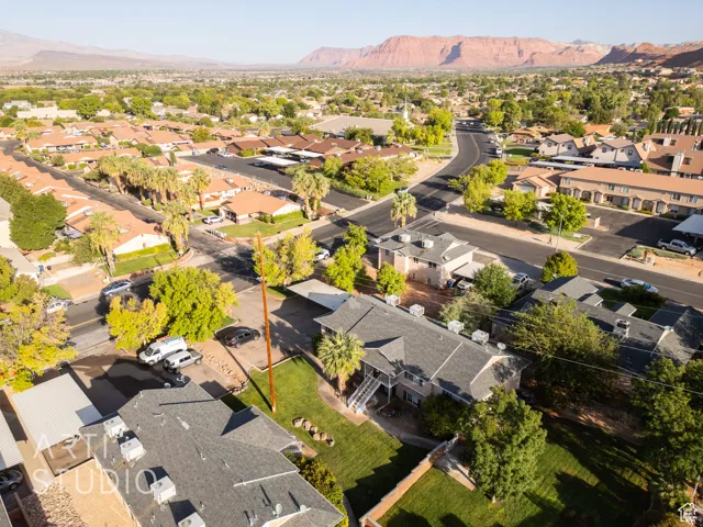 Aerial view of residential area featuring a mountainous background