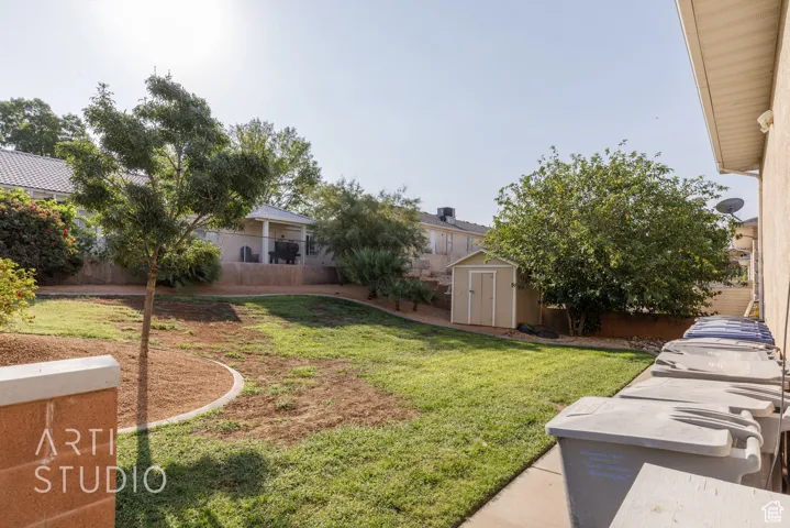 View of yard with a shed