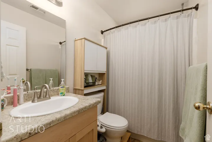 Full bath with vanity and toilet