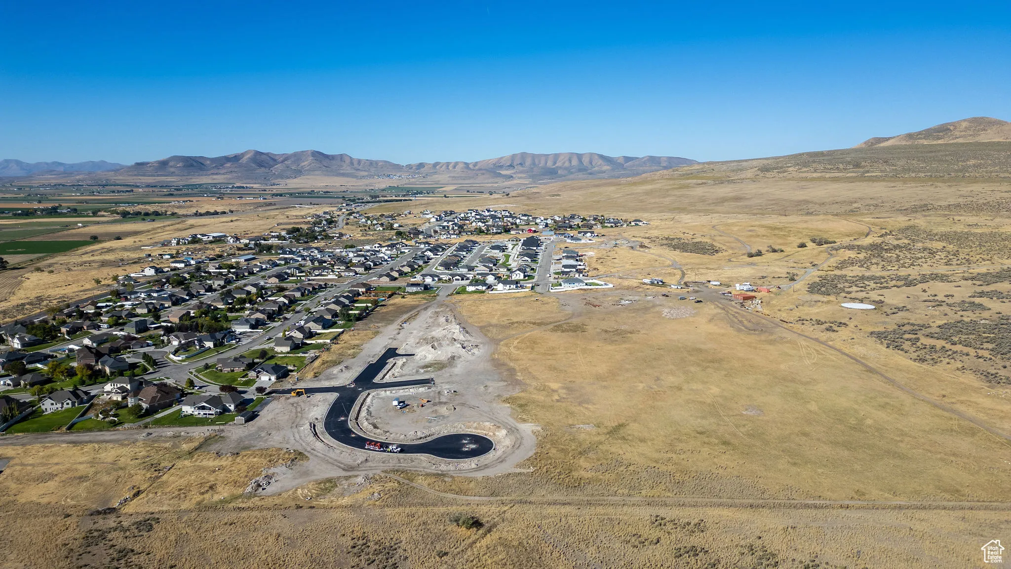 View of property location featuring nearby suburban area and a mountainous background
