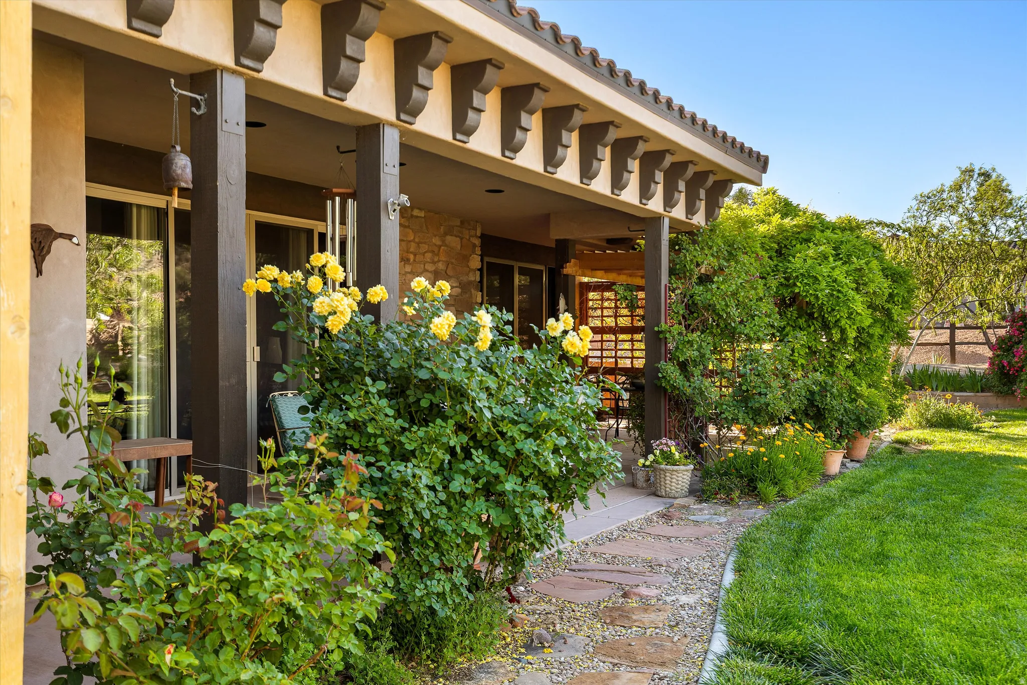 Covered patio with exposed wood beams and corbels