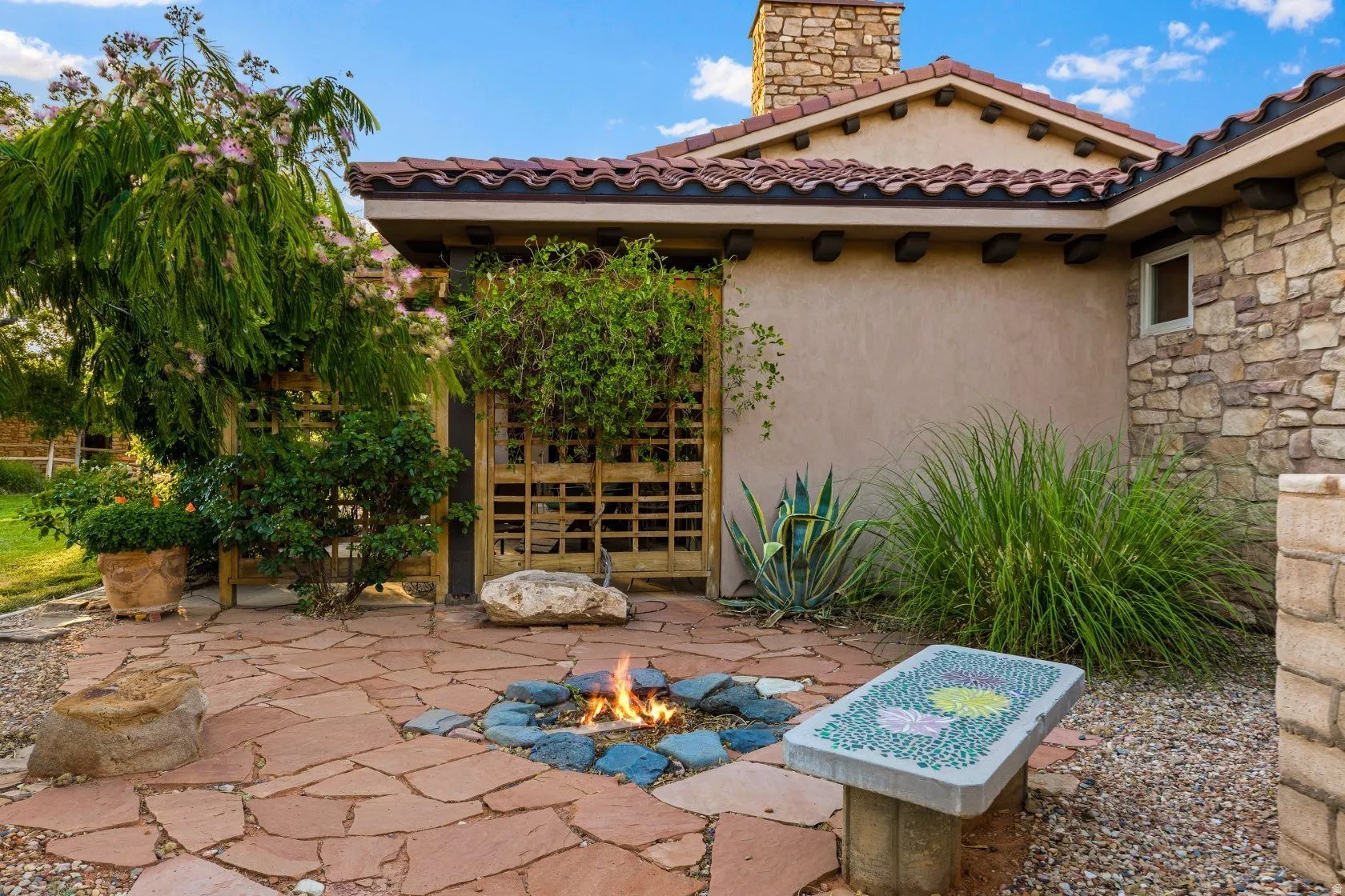 Flagstone patio featuring a built-in fire pit