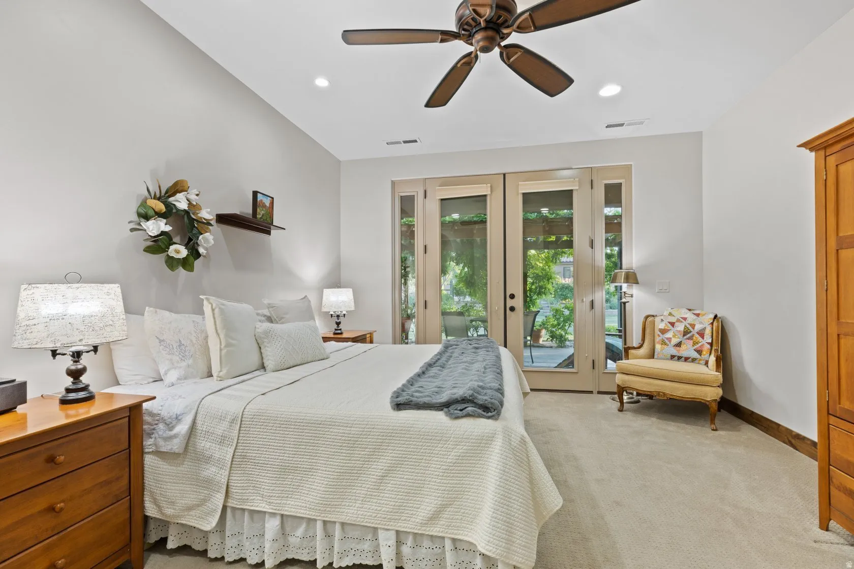 Bedroom featuring light-colored carpeting, a vaulted ceiling, and recessed lighting
