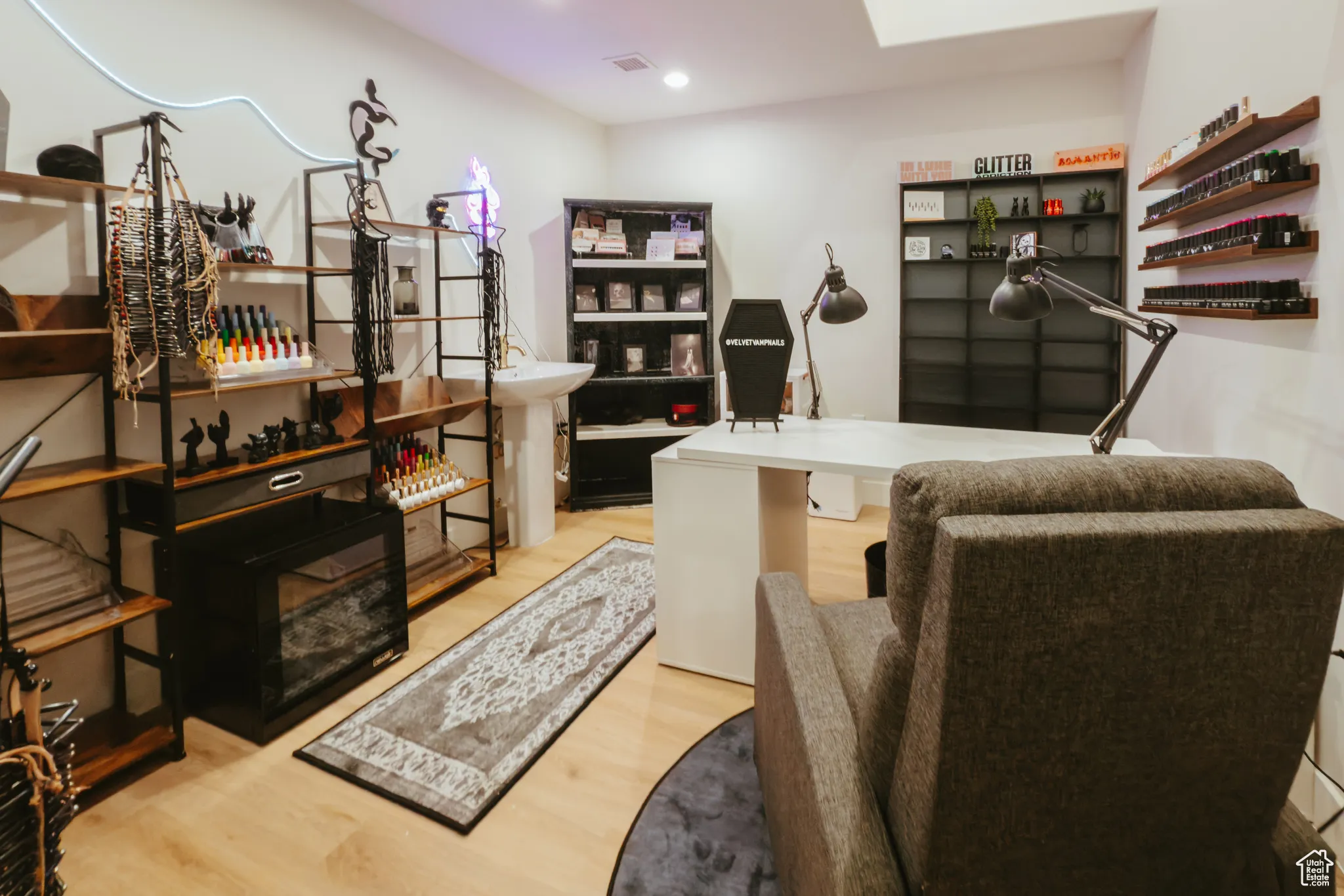 Office area with wood finished floors and recessed lighting