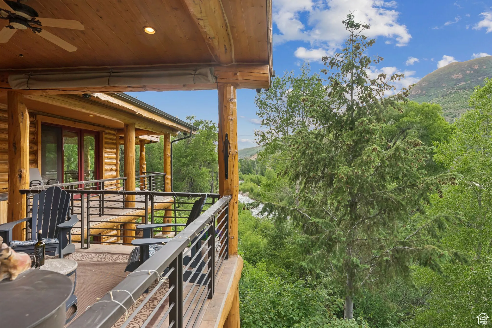 Balcony with a mountain view and a ceiling fan