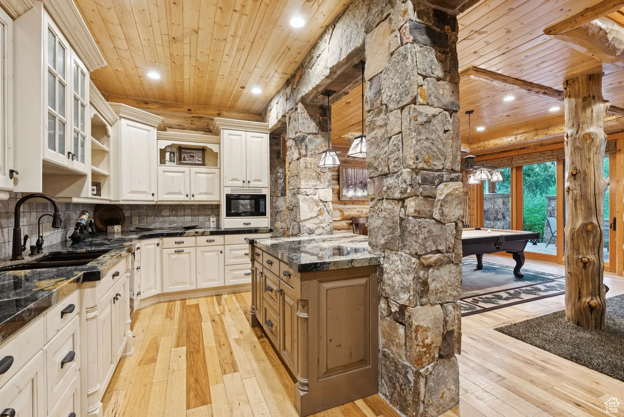 Kitchen featuring tongue-in-groove ceiling, light wood-style flooring, recessed lighting, billiards table, and decorative backsplash