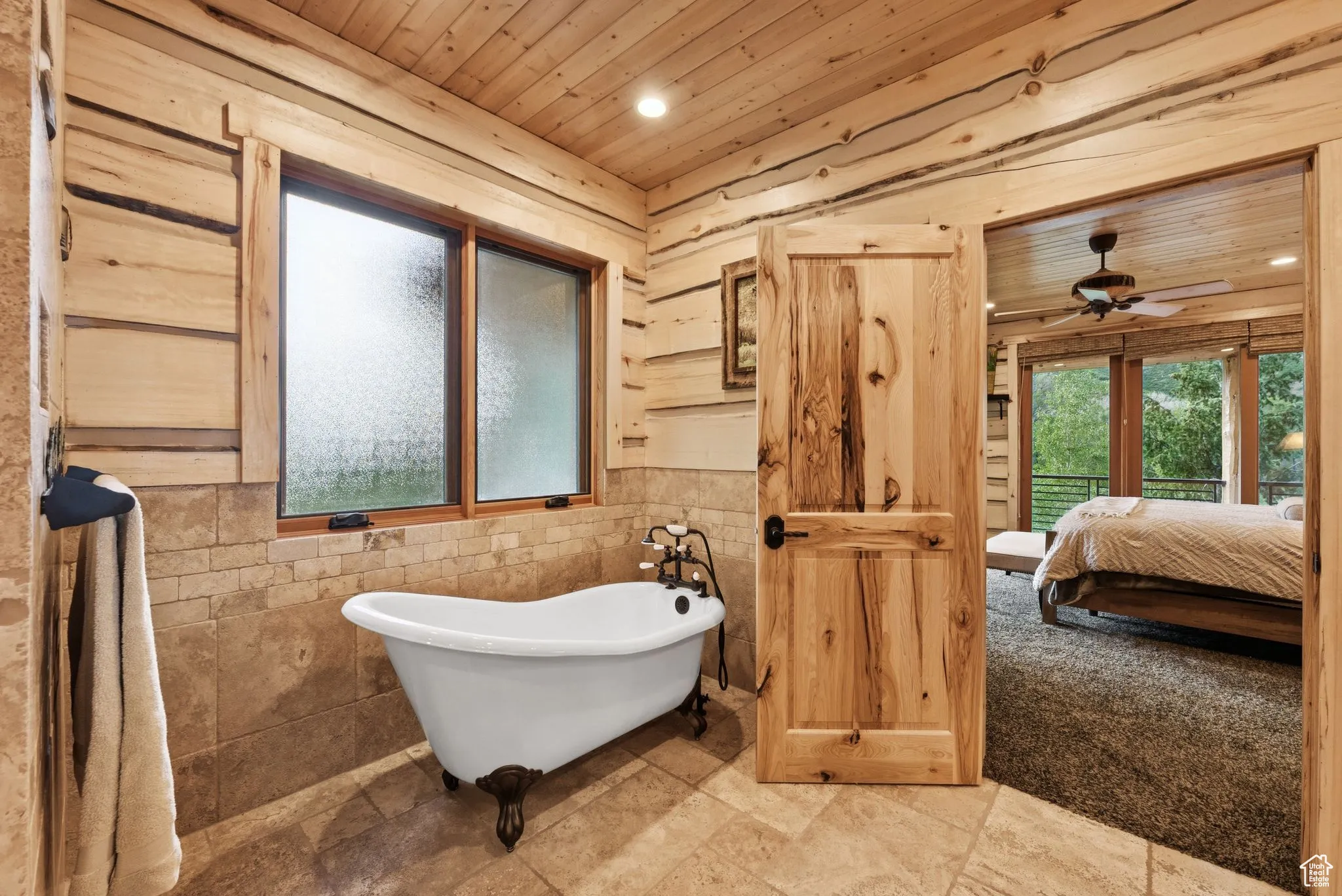 Bathroom with tongue-in-groove ceiling, a soaking tub, ceiling fan, ensuite bathroom, and recessed lighting
