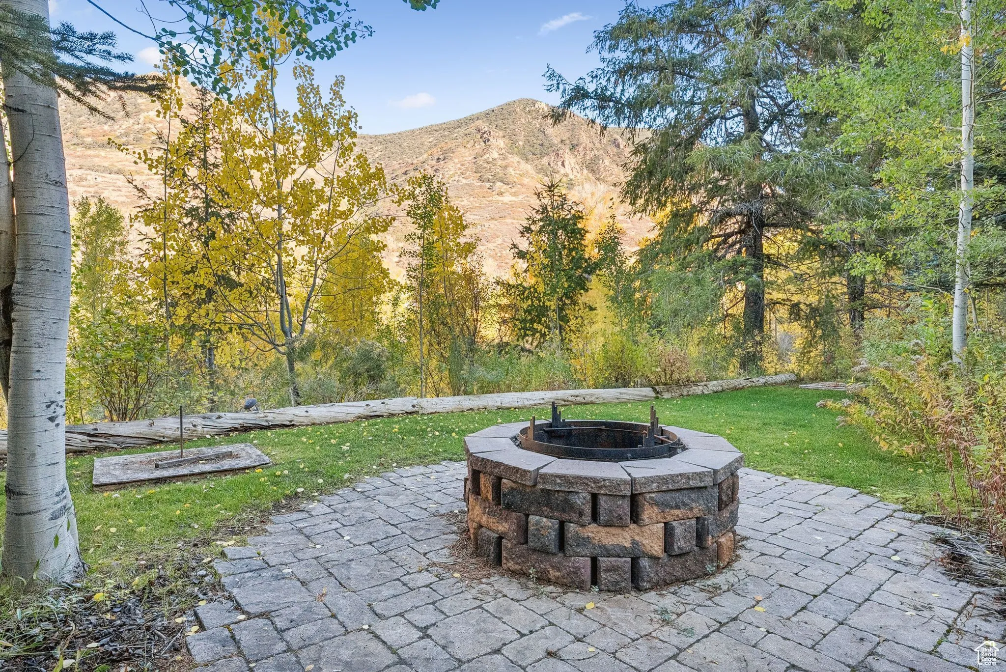 View of patio / terrace featuring a mountain view and an outdoor fire pit