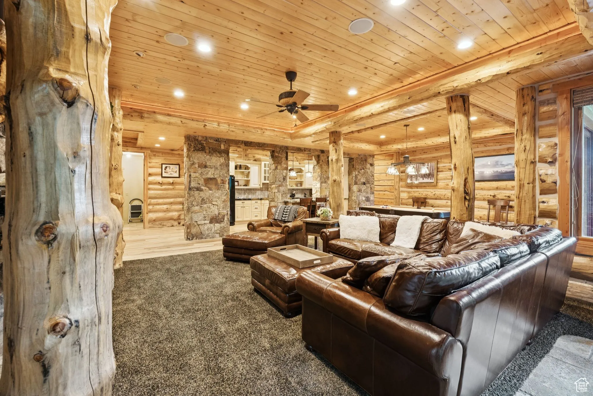 Cinema featuring rustic walls, tongue-in-groove ceiling, recessed lighting, carpet, and ceiling fan