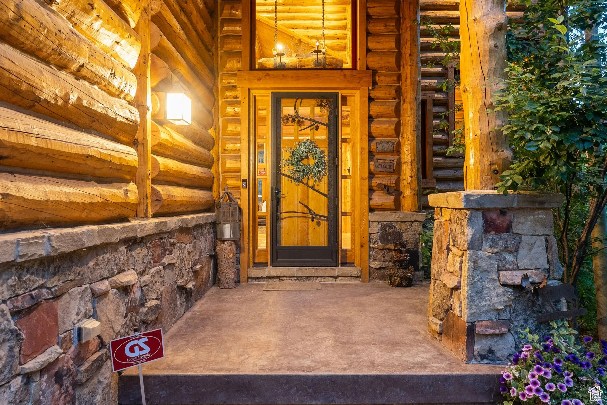 Doorway to property with stone siding