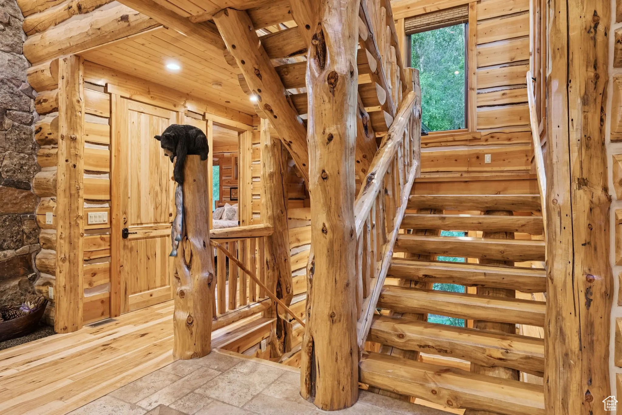 Stairs featuring recessed lighting, stone tile floors, and tongue-in-groove ceiling