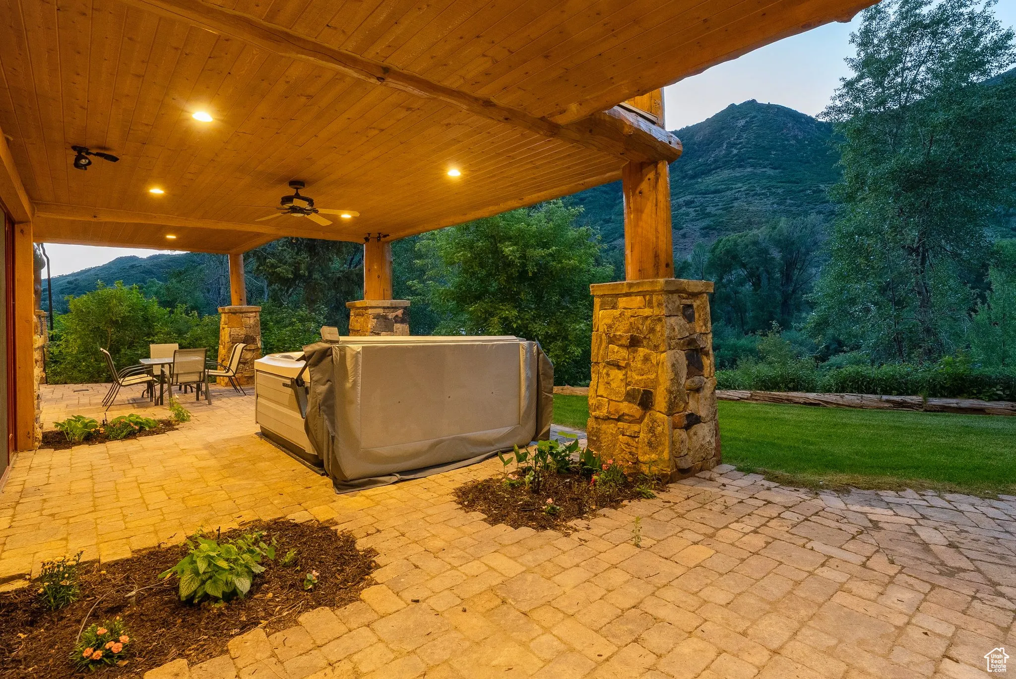 View of patio / terrace with a mountain view, outdoor dining area, and ceiling fan