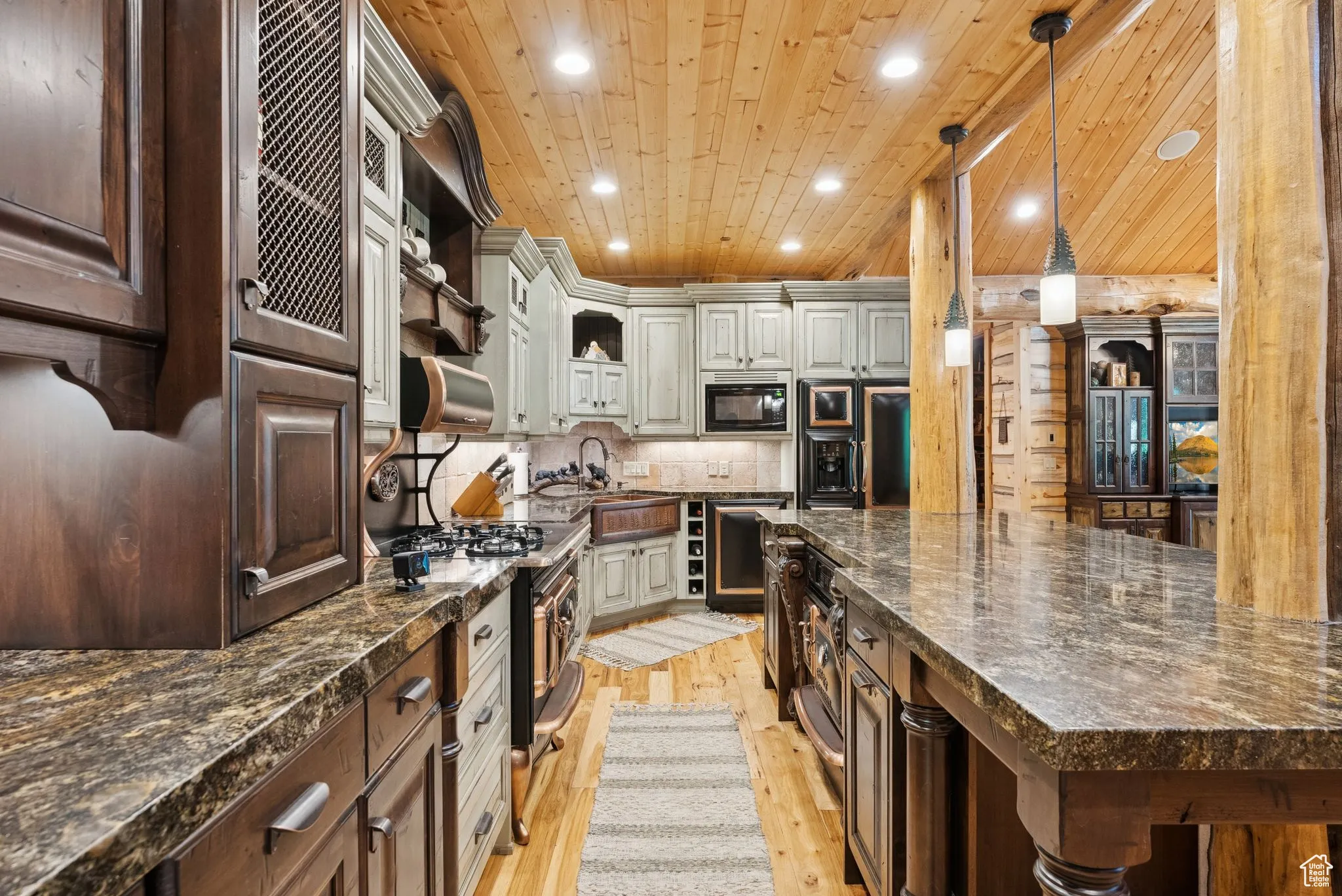 Kitchen with open shelves, tongue-in-groove ceiling, black appliances, light wood floors, and recessed lighting