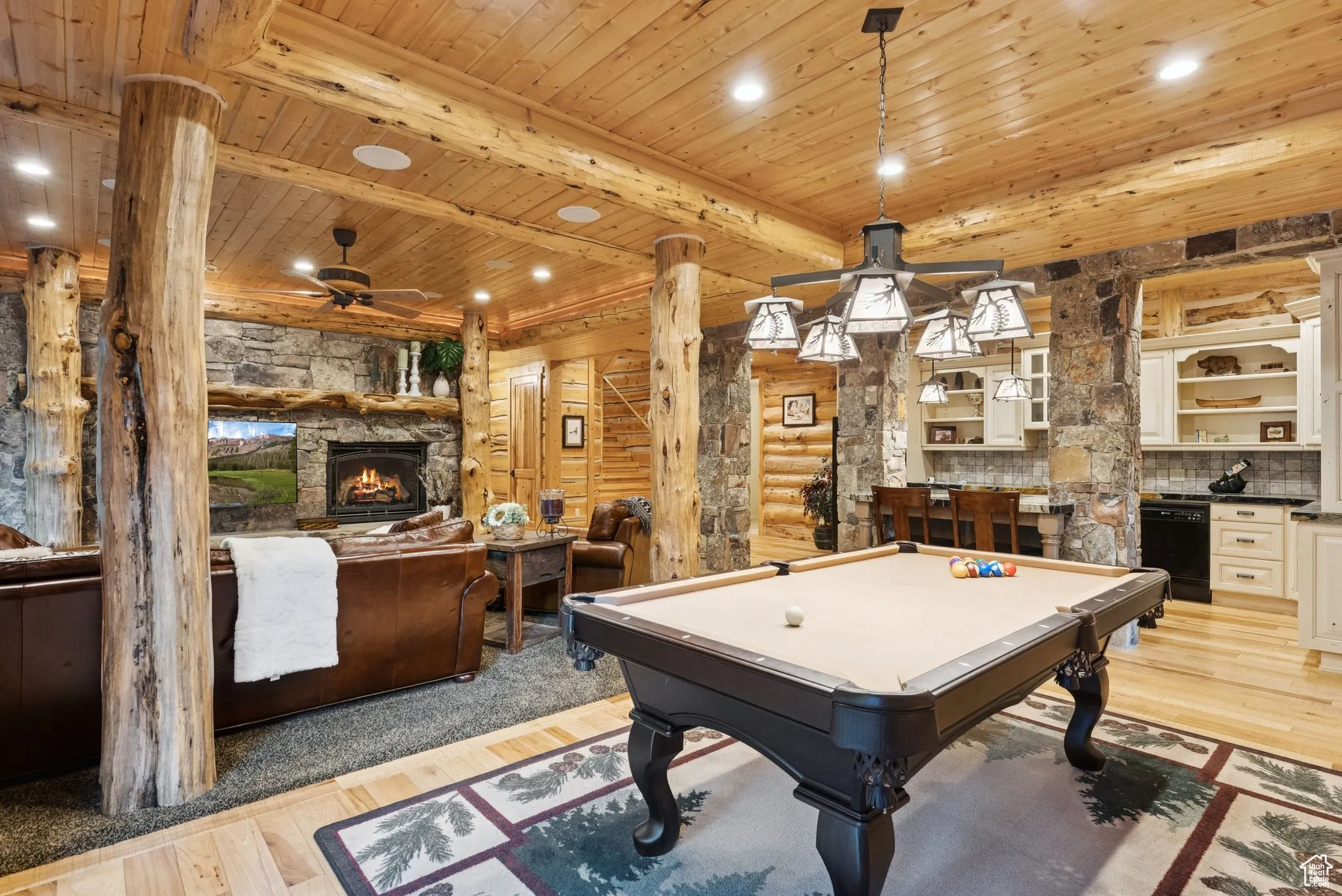 Playroom with a ceiling fan, a fireplace, a tongue-in-groove ceiling with exposed beams, billiards, and light wood flooring