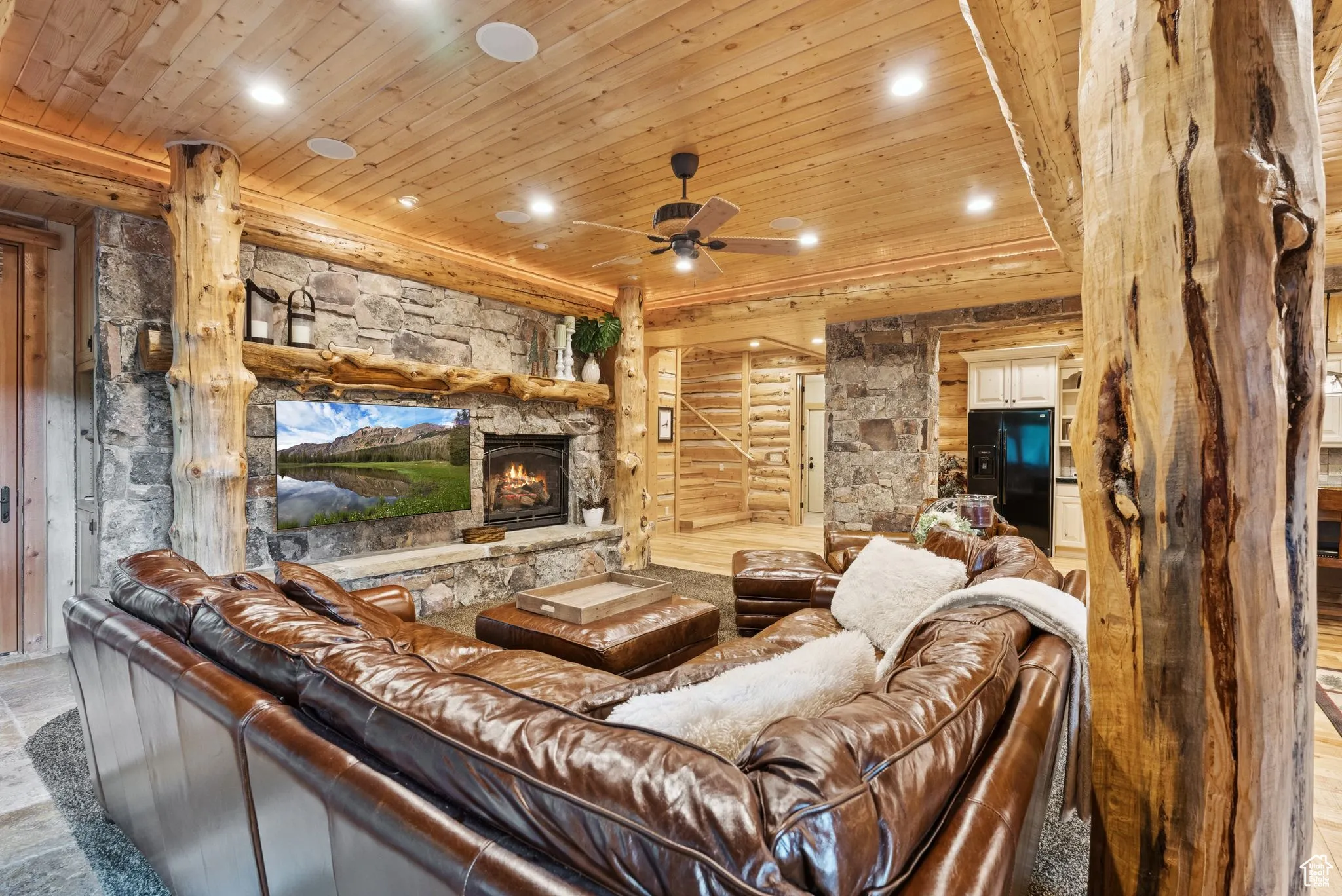 Living area featuring tongue-in-groove ceiling, recessed lighting, a fireplace, and ceiling fan