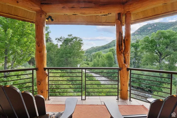 Master bedroom balcony with a mountain view