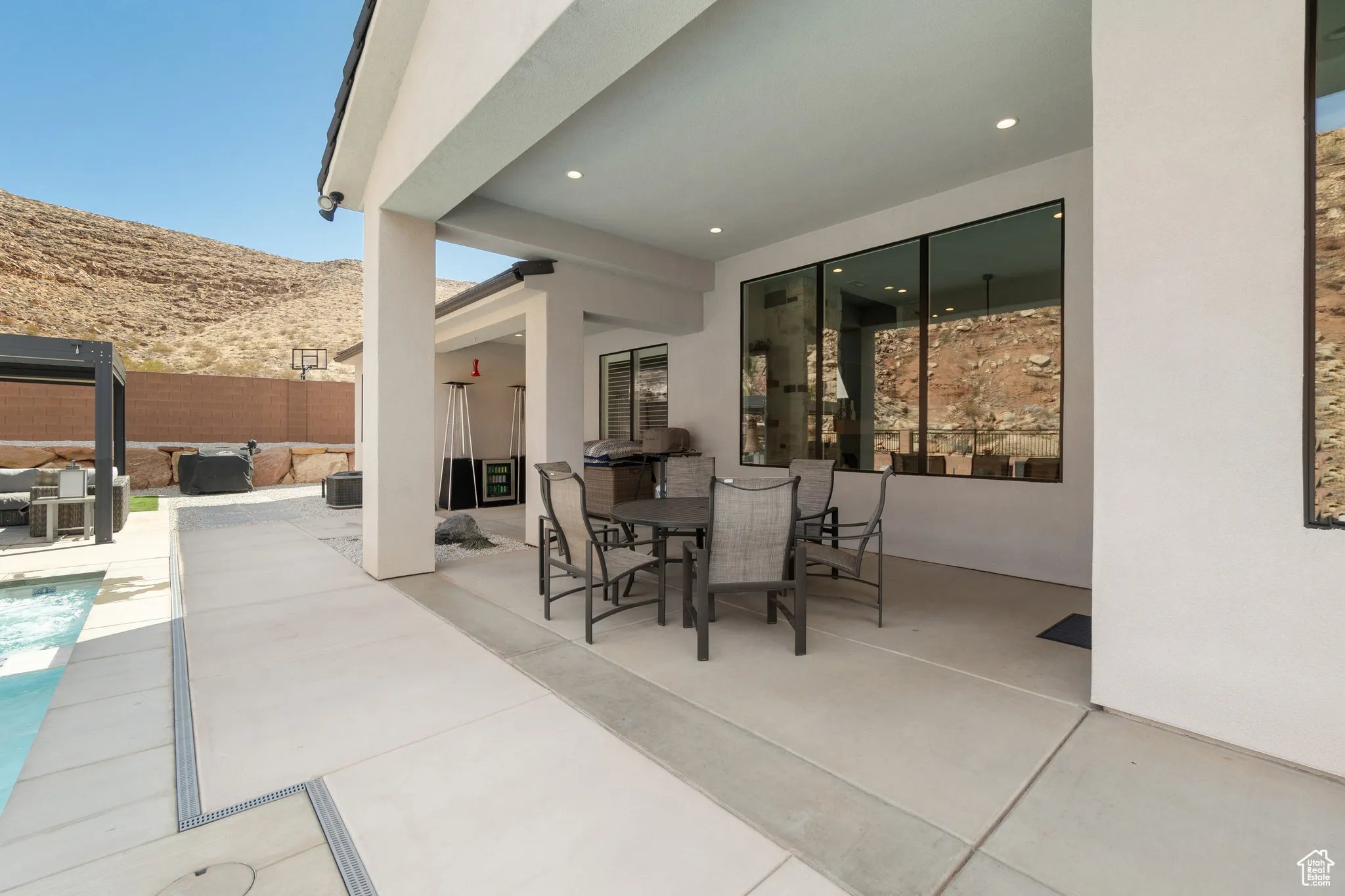 View of patio / terrace featuring a mountain view, outdoor dining space, and an outdoor hangout area