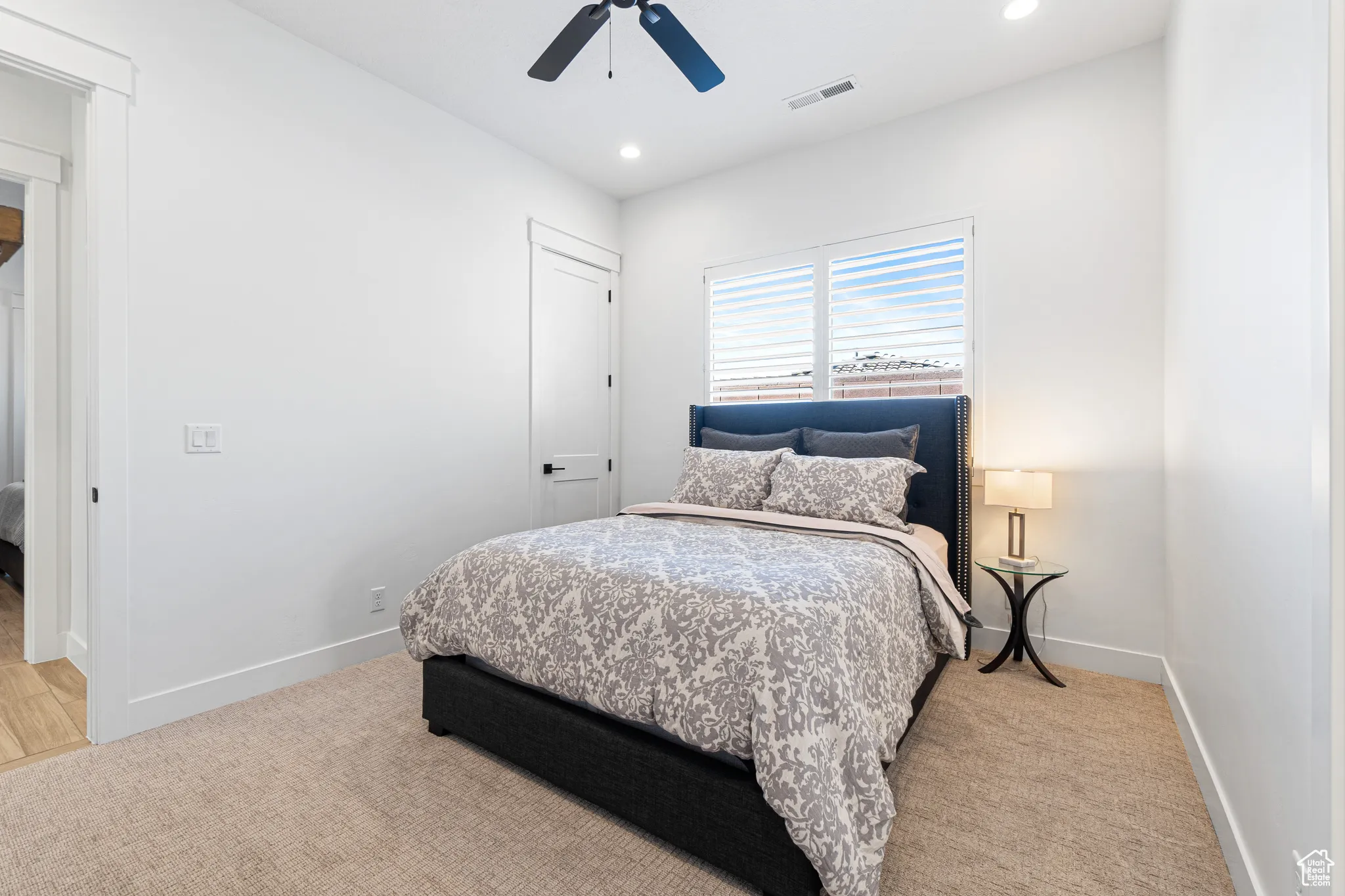 Bedroom with recessed lighting, a ceiling fan, and light colored carpet