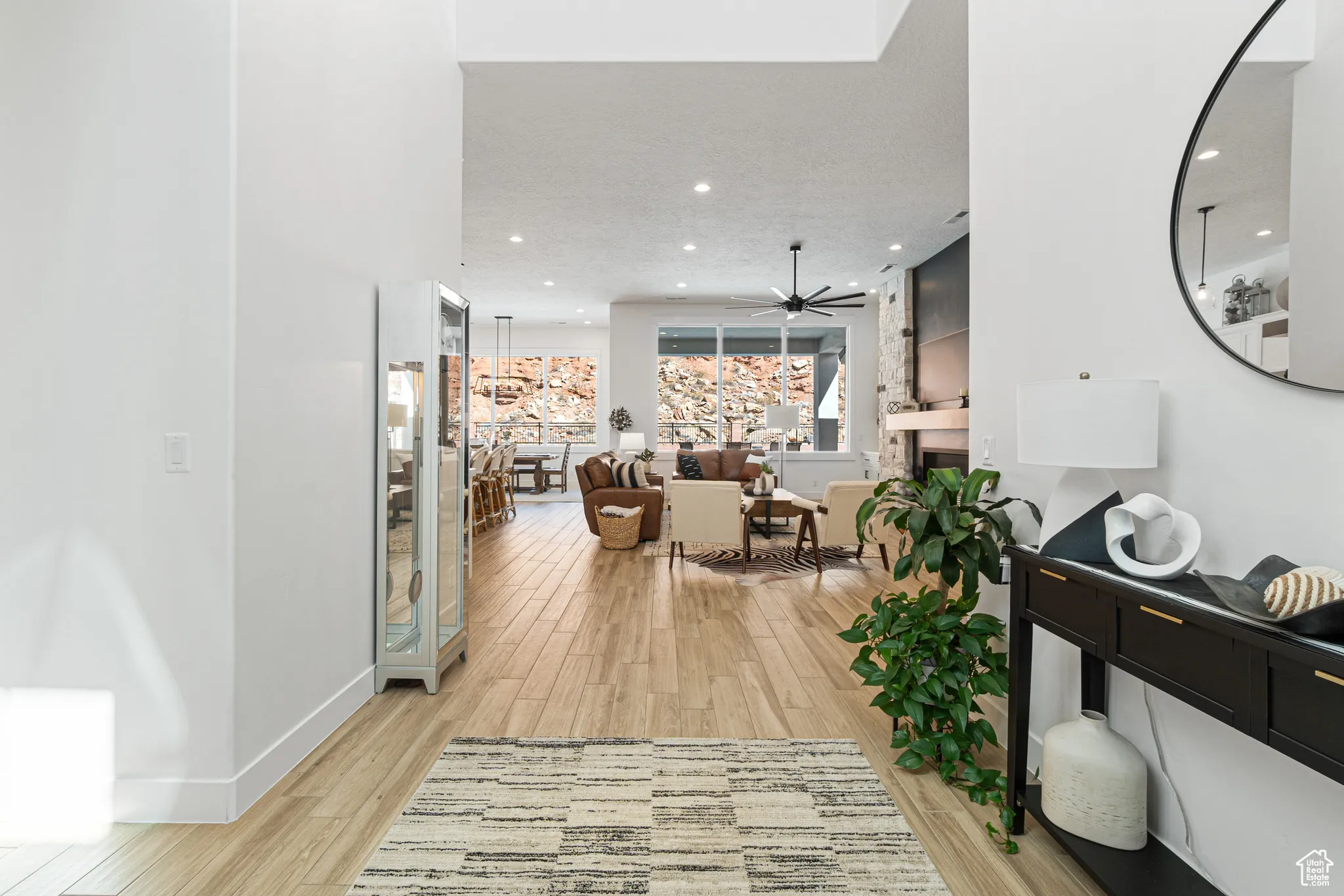 Corridor featuring light wood-type flooring and recessed lighting