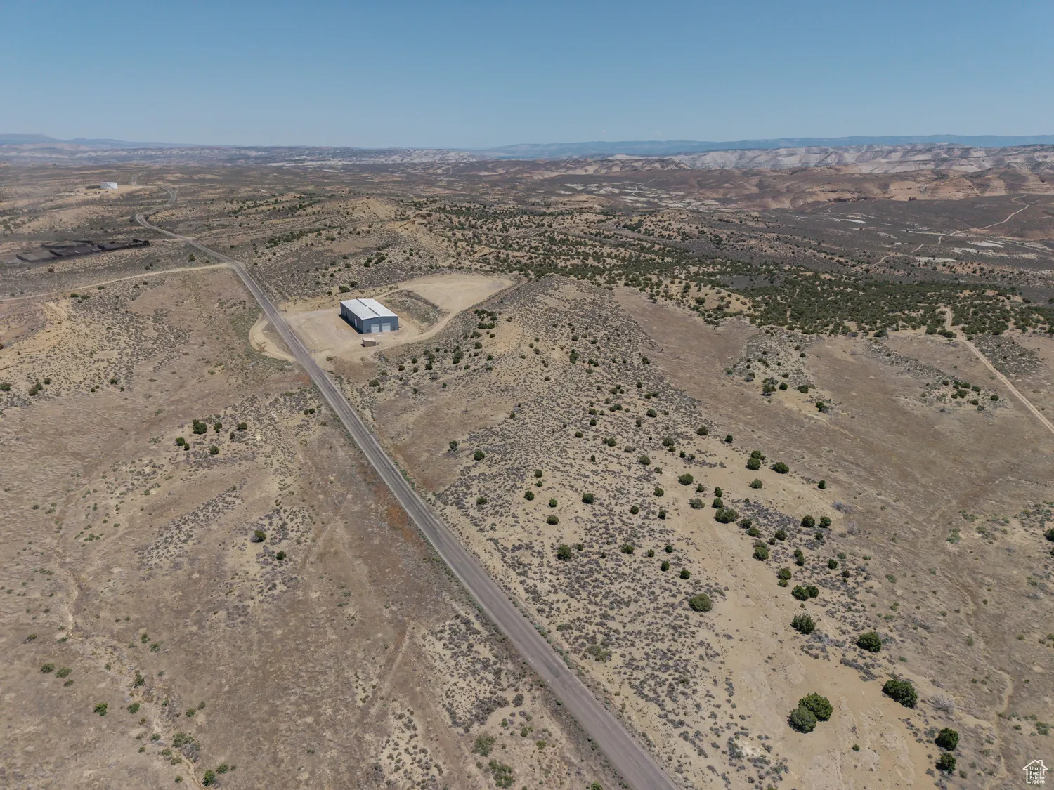 Aerial view of property's location with a desert landscape and rural landscape