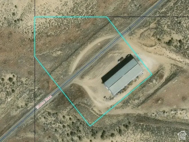 Aerial map of property and surrounding area featuring property parcel outlined