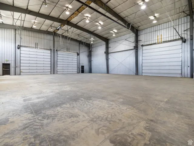 Garage featuring metal wall