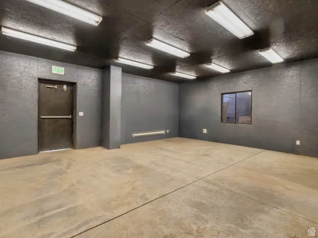 Empty room featuring concrete floors