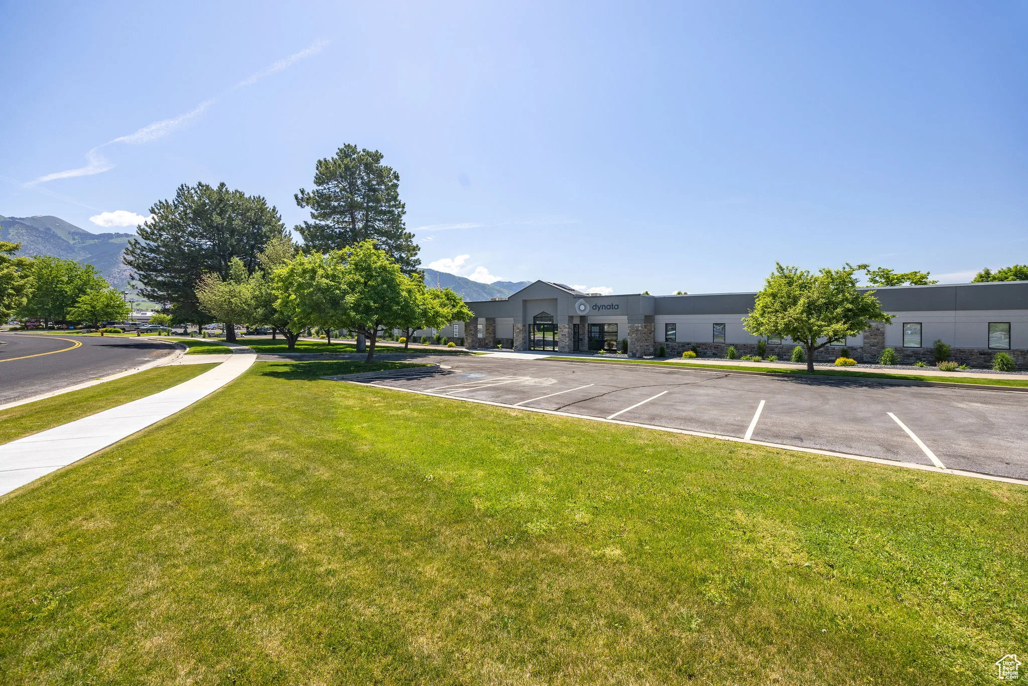 View of green lawn featuring a mountain view