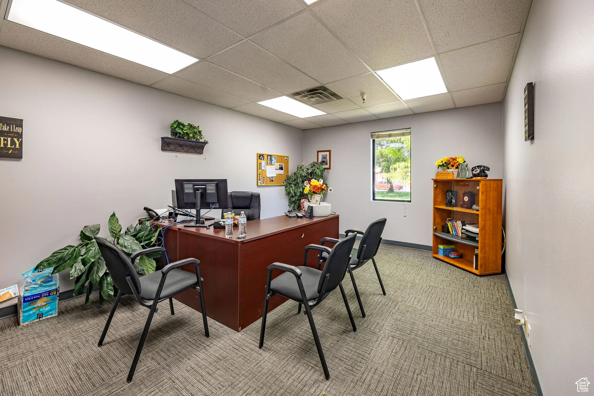 Office featuring carpet and a drop ceiling