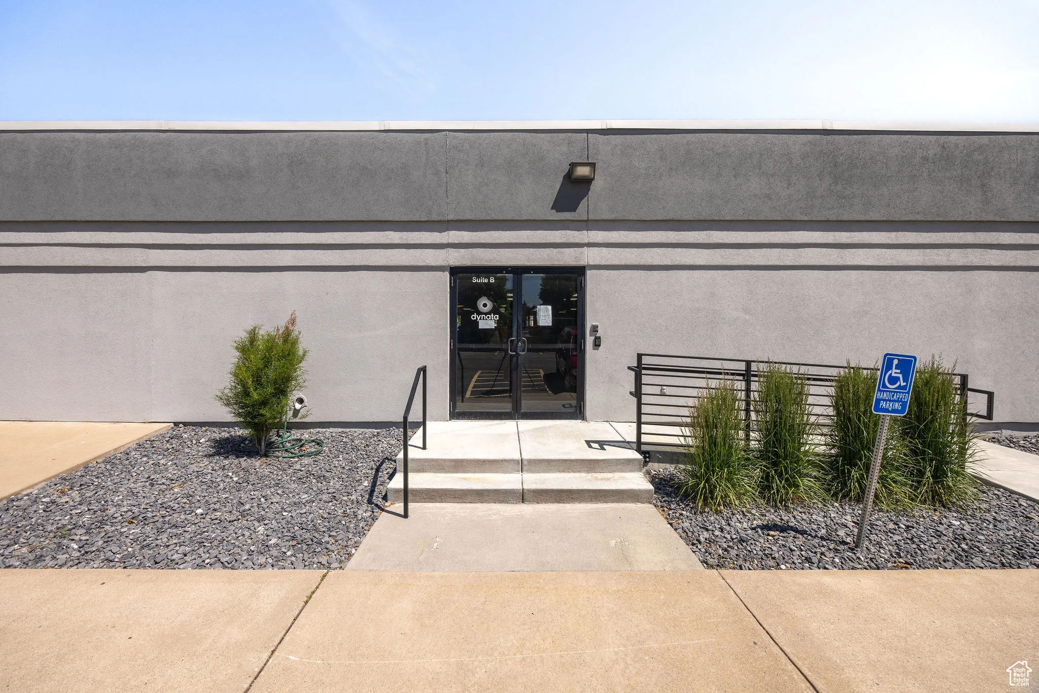 Entrance to property with stucco siding and french doors
