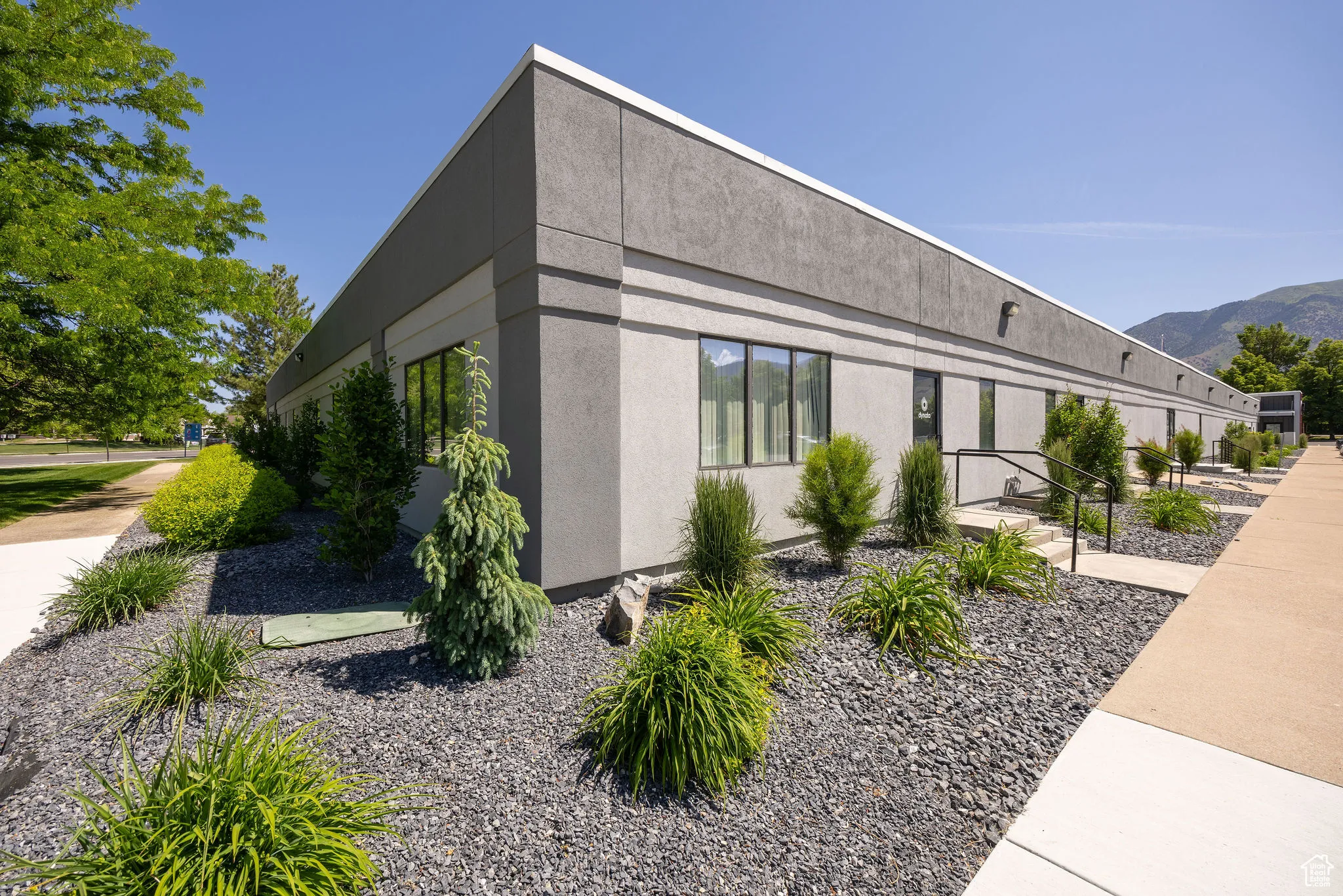 View of property exterior featuring stucco siding and a mountain view