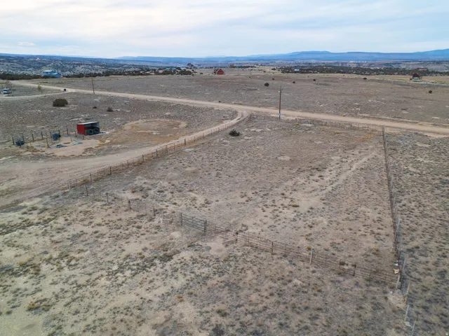 Aerial view of sparsely populated area featuring a mountainous background