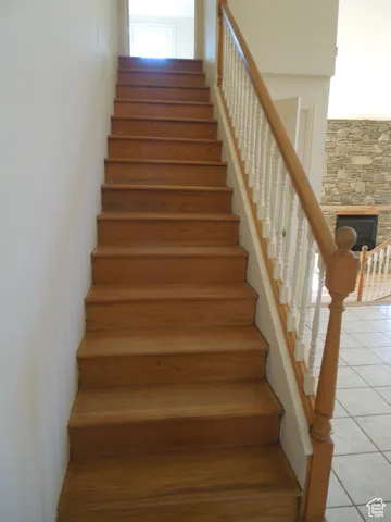 Stairs with tile patterned floors