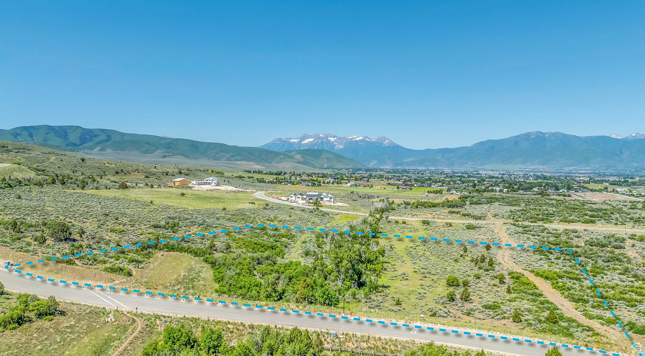 View of mountain backdrop featuring rural landscape