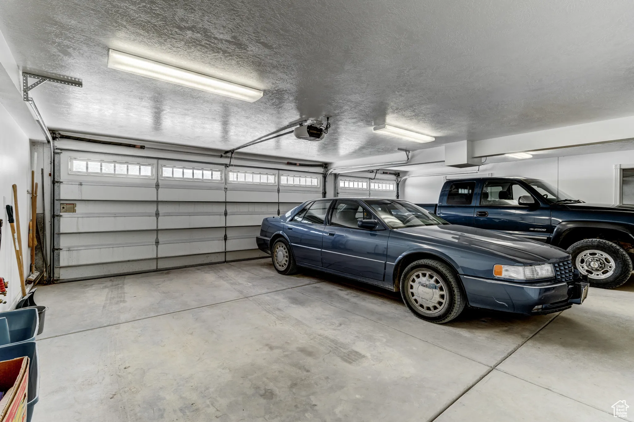 Garage featuring a garage door opener