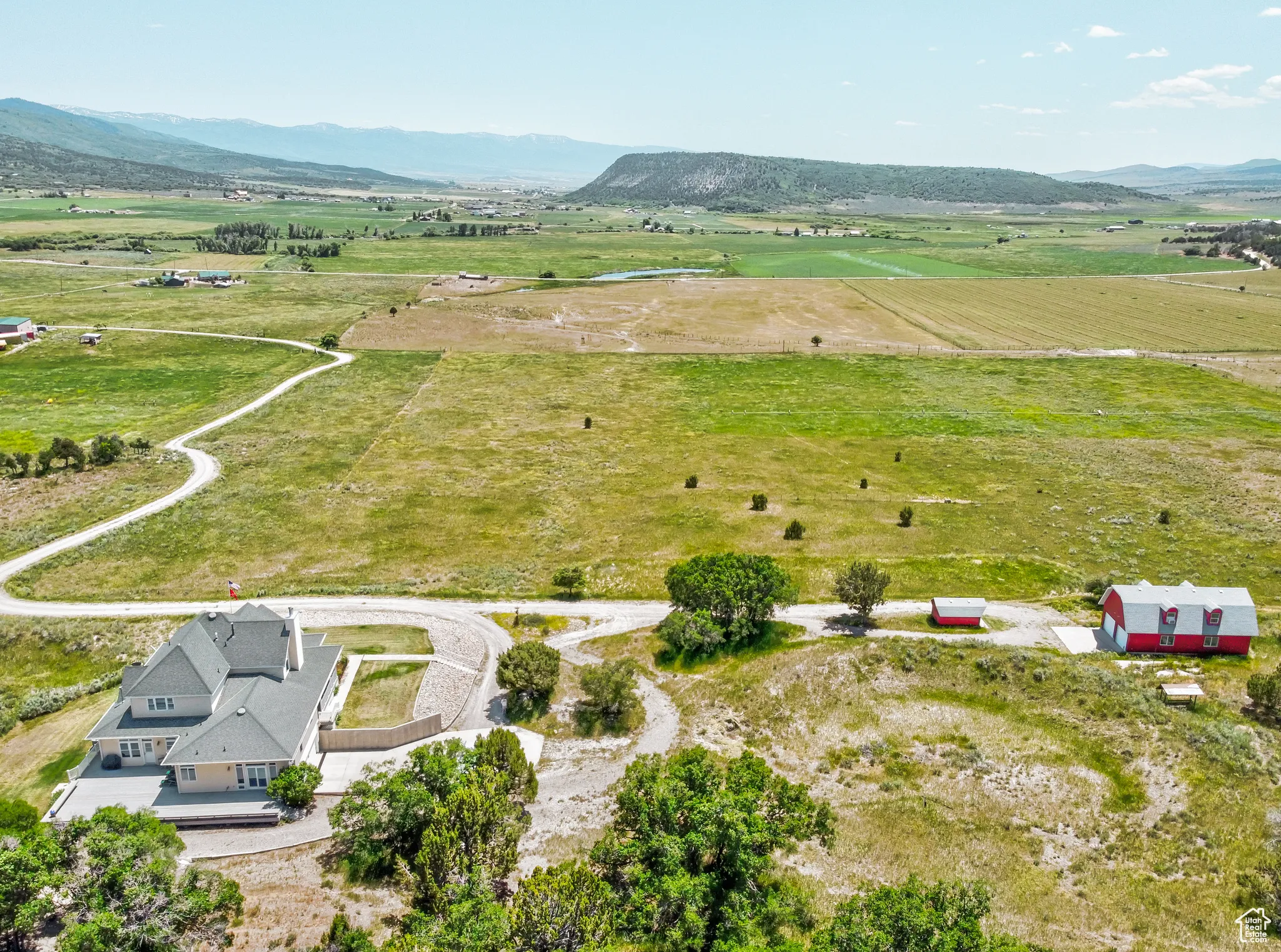 Aerial view of sparsely populated area featuring a mountainous background