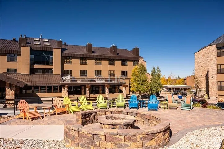 View of patio with a fire pit