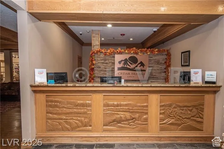 Reception area with ornamental molding and a bar