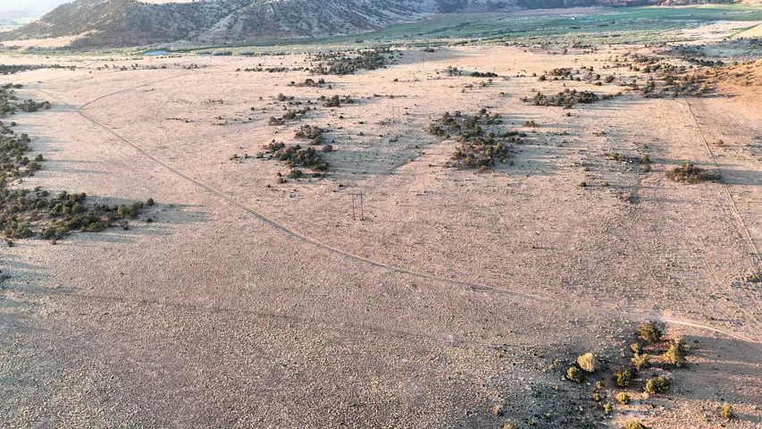 View of mountain background featuring a desert landscape and rural landscape
