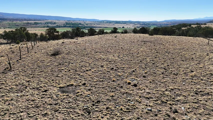 View of mountain background featuring rural landscape