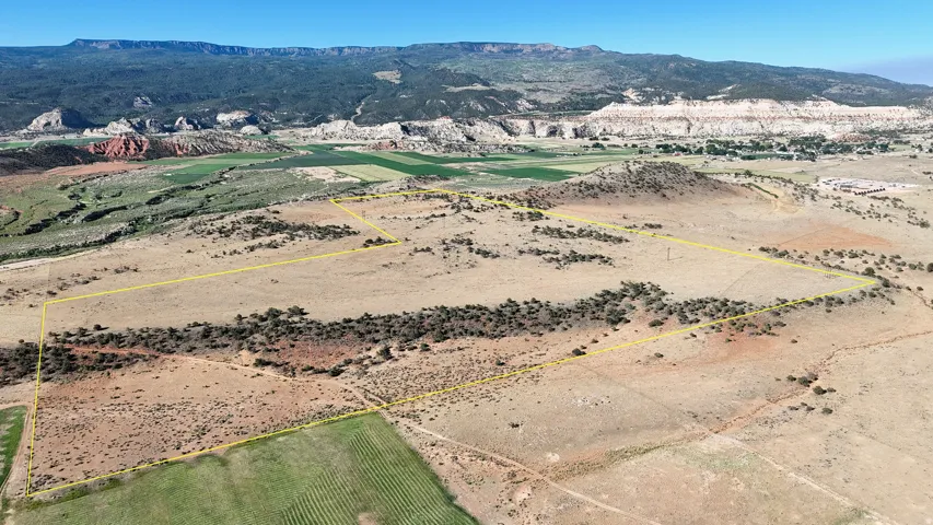 Aerial view of sparsely populated area with mountains and property boundaries highlighted
